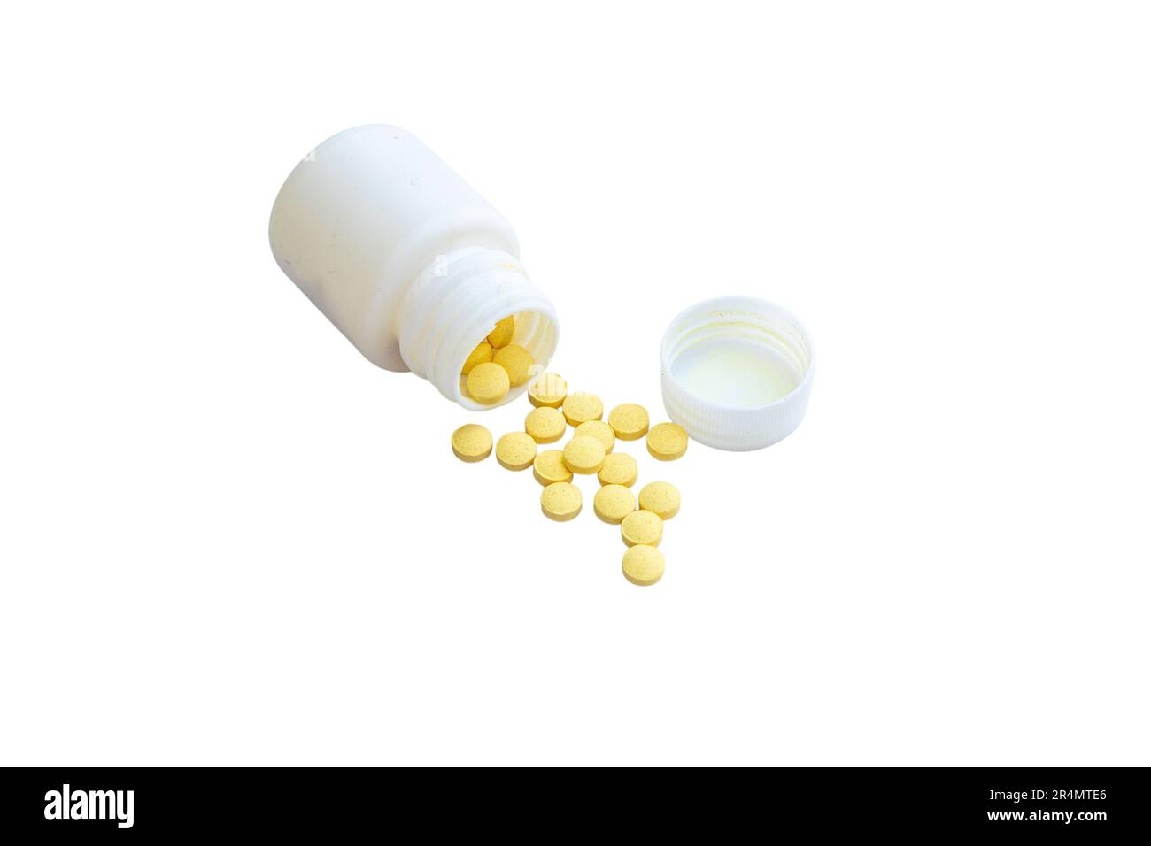 Bottle with yellow pills on white isolated background with copy space Stock Photo
