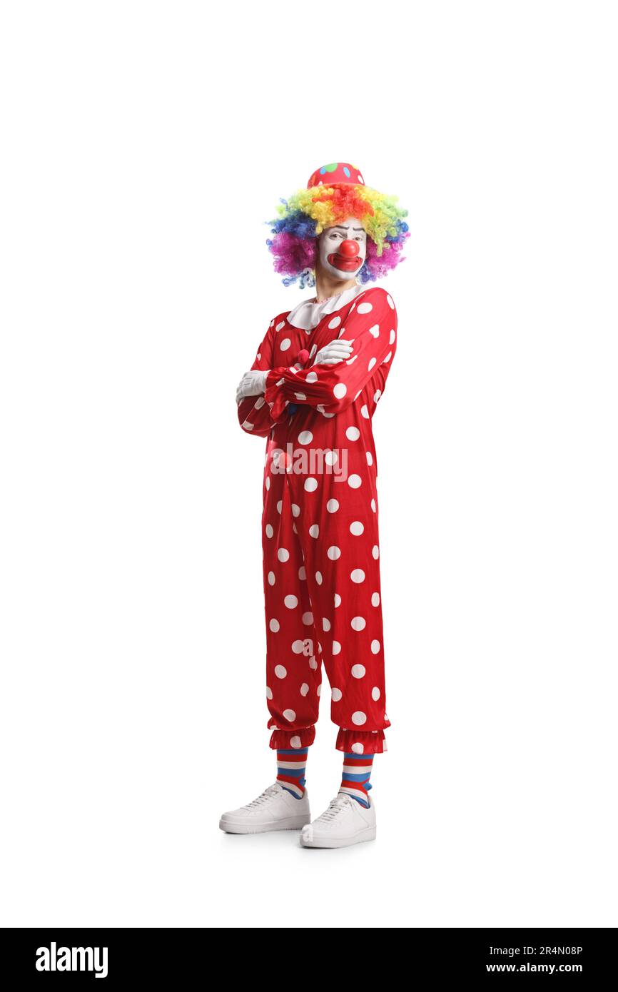 Clown in a red costume posing with folded arms isolated on white background Stock Photo
