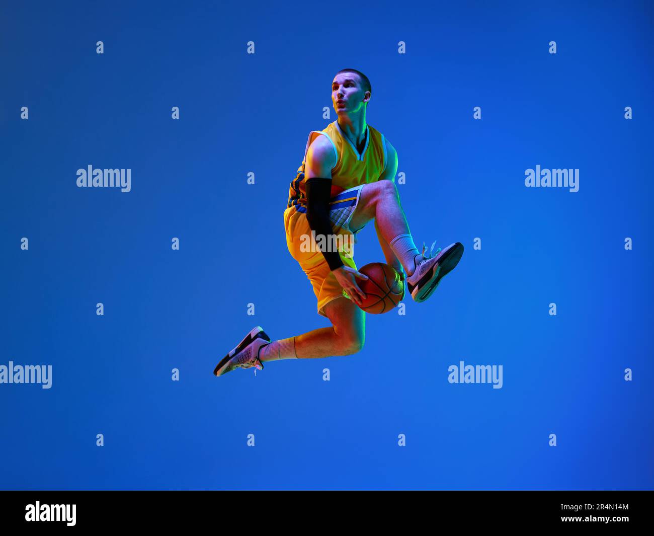 Dynamic image of professional male basketball player in motion, jumping ...