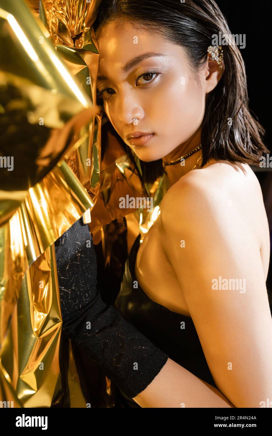 Short gold dress hi-res stock photography and images - Alamy