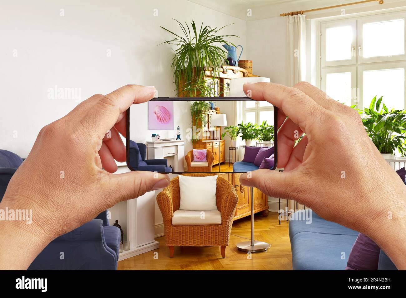 Augmented reality concept hands holding smart phone with AR interior