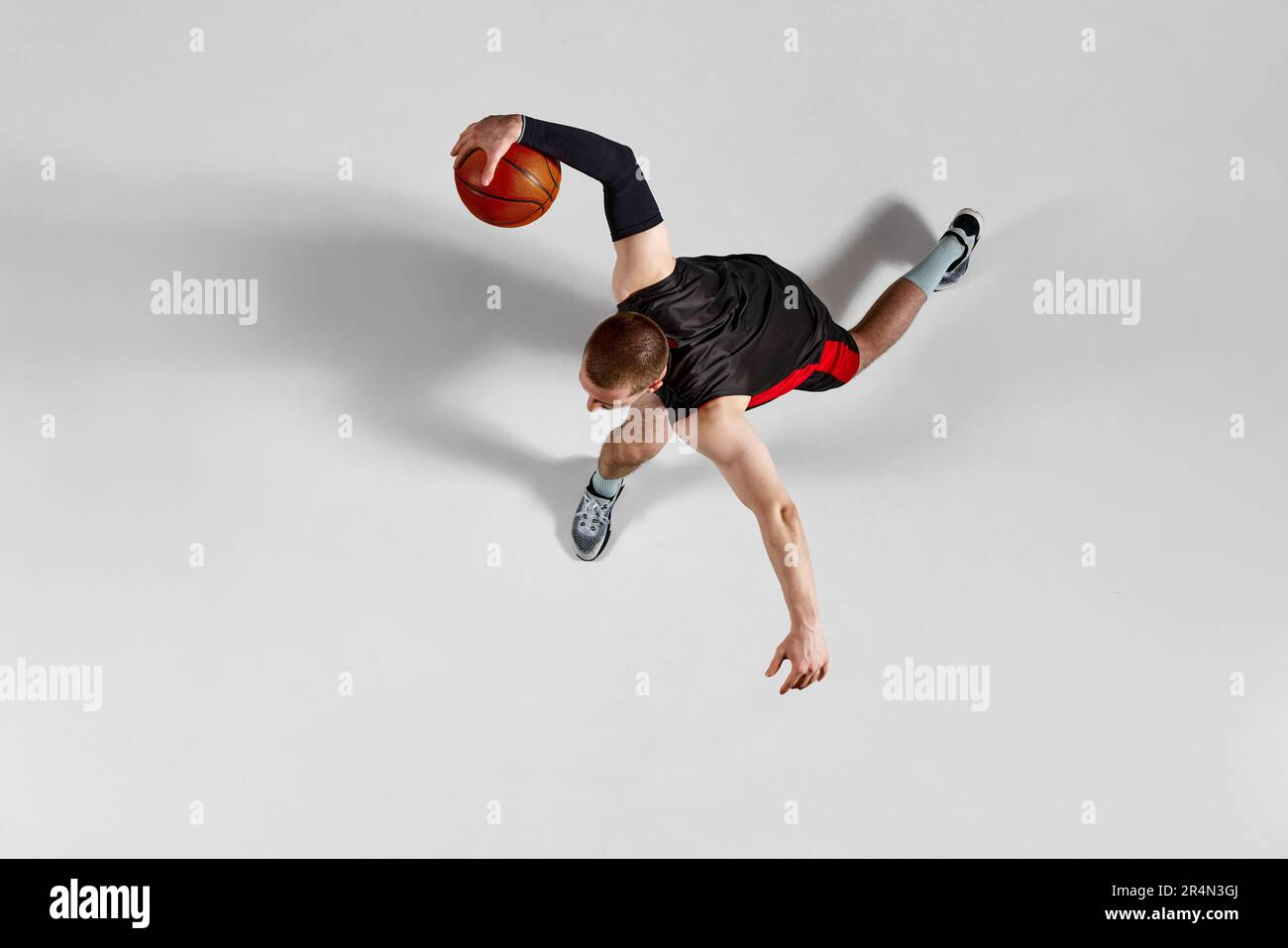 Dynamic image of professional sportsman, basketball player in motion ...