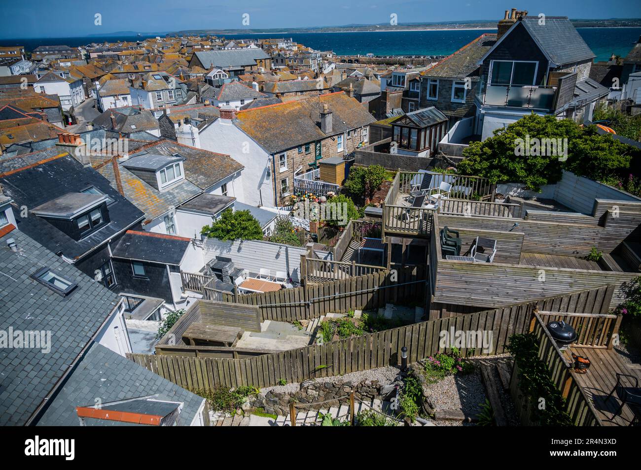 Every bit of space is used by propeerties and their guardens in the crowded town - Sunny weather for the bank holiday weekend in St Ives. Stock Photo