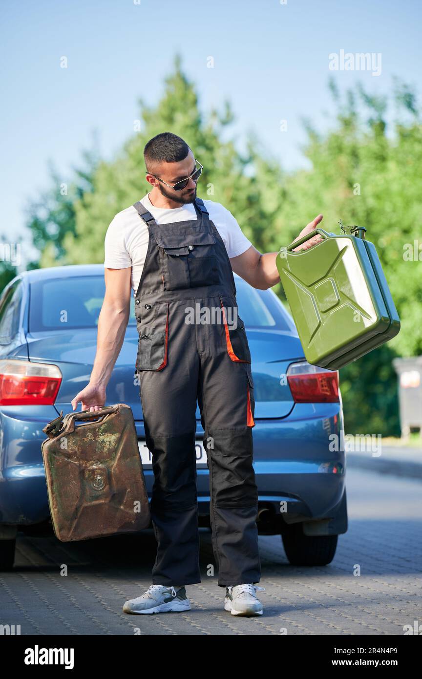 Gas station worker refueled two canisters and waiting for customer