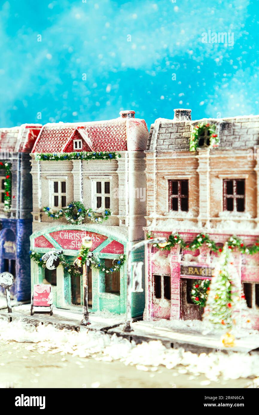 Winter snowy European street decorated for Christmas. Homemade decorated toy houses. All elements of the image are made and drawn by hand. Selective f Stock Photo
