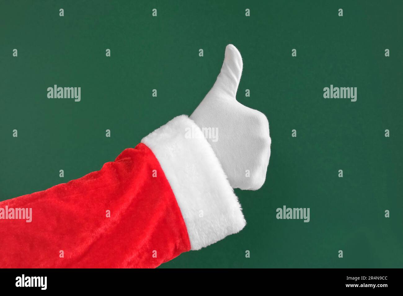 Santa Claus Hands Making Thumg Up Sign and OK Gesture Isolated On Green ...