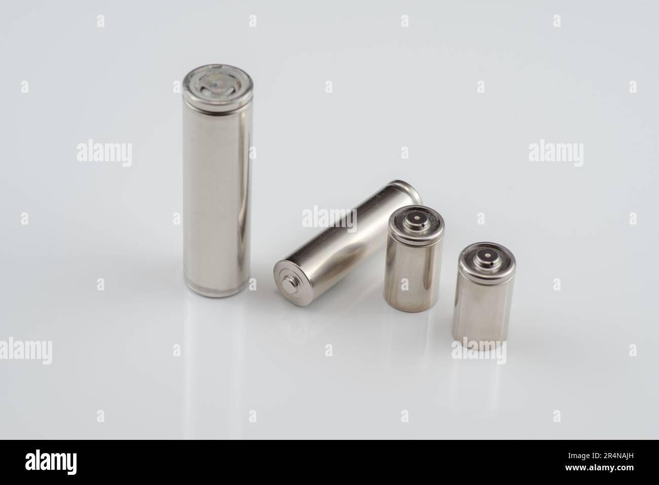 Alkaline batteries lie on white background, The concept of vital energy reserve Stock Photo