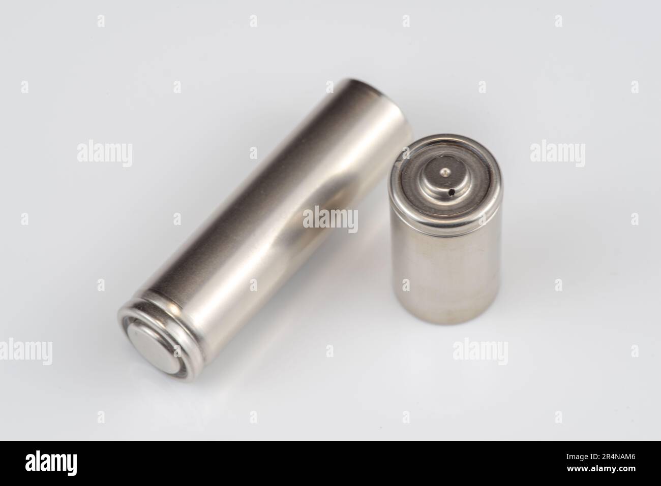 Alkaline batteries lie on white background, The concept of vital energy reserve Stock Photo