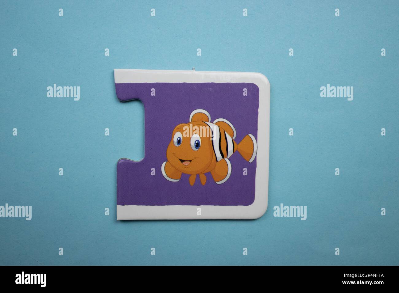 Picture puzzles placed on a blue background. Fish Stock Photo
