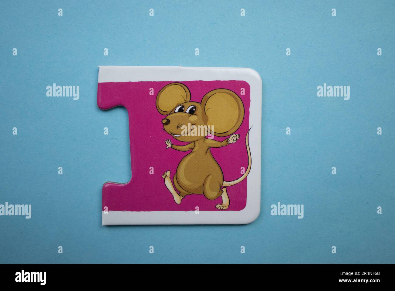 Picture puzzles placed on a blue background. Mouse Stock Photo