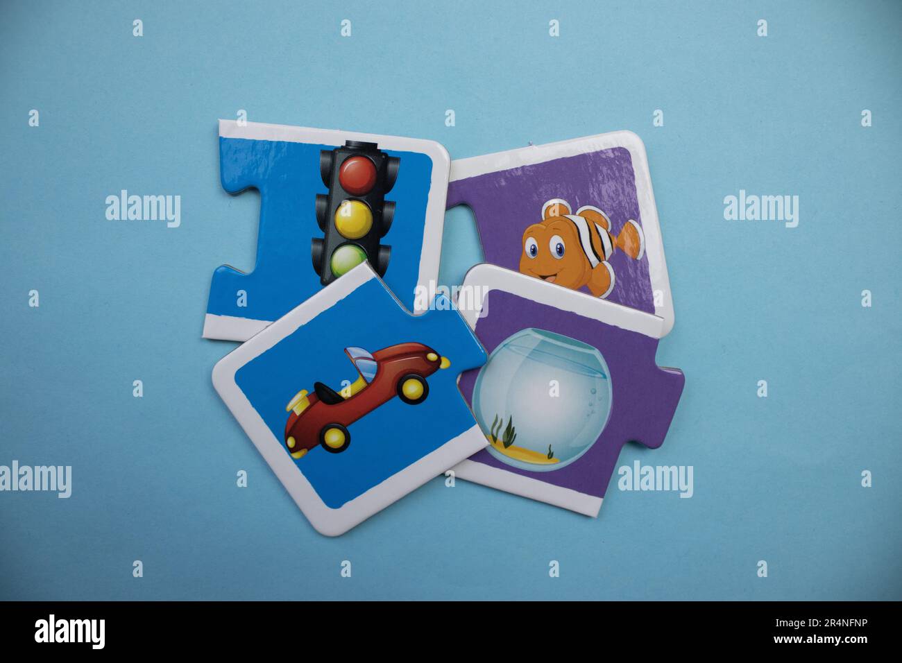 Picture puzzles superimposed on a blue background. Traffic signs, car