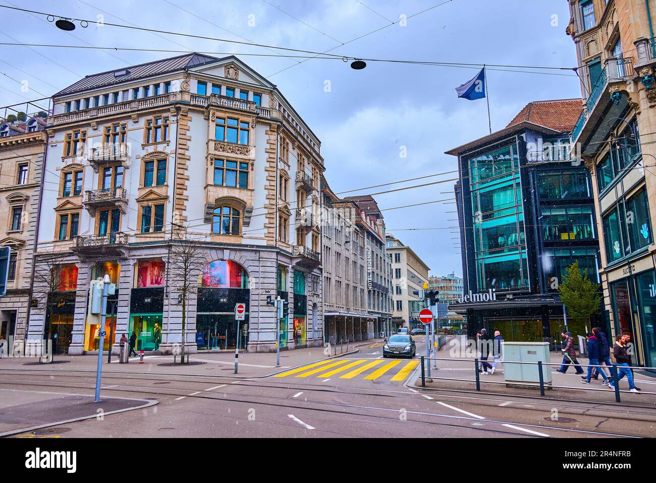 ZURICH, SWITZERLAND - APRIL 3, 2022: Bahnhofstrasse with department stores and boutiques is the most famous shopping area in the city, on April 3 in Z Stock Photo