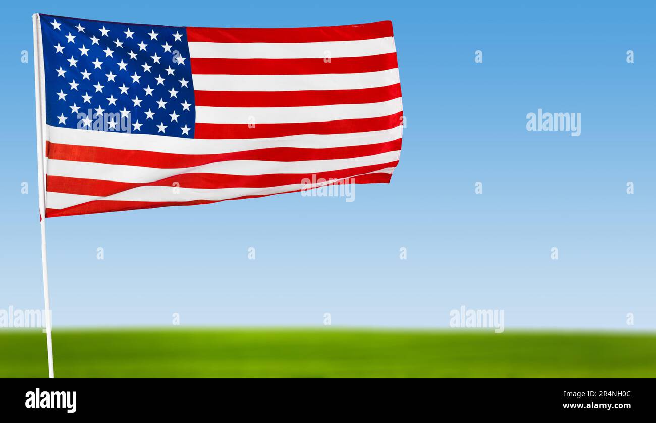 American flag against blue sky Stock Photo - Alamy