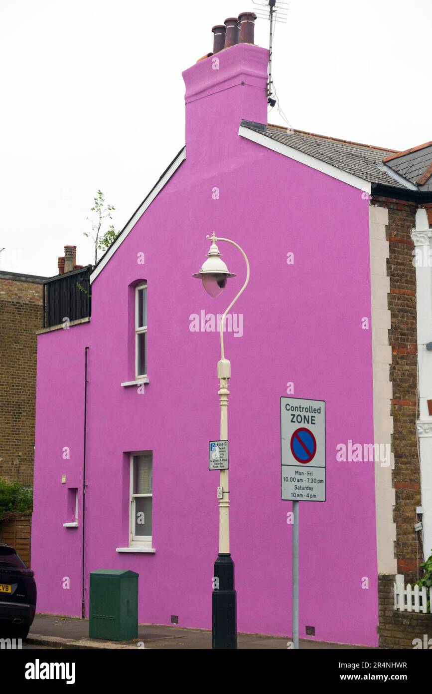 Gable end, rendered and painted purple / pink / lilac with bright paint