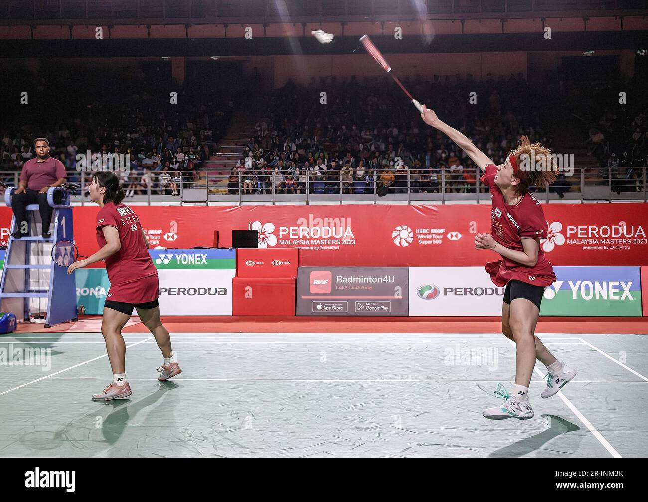 Malaysia's Thinaah Muralitharan and Pearly Tan use three languages to communicate on the badminton court