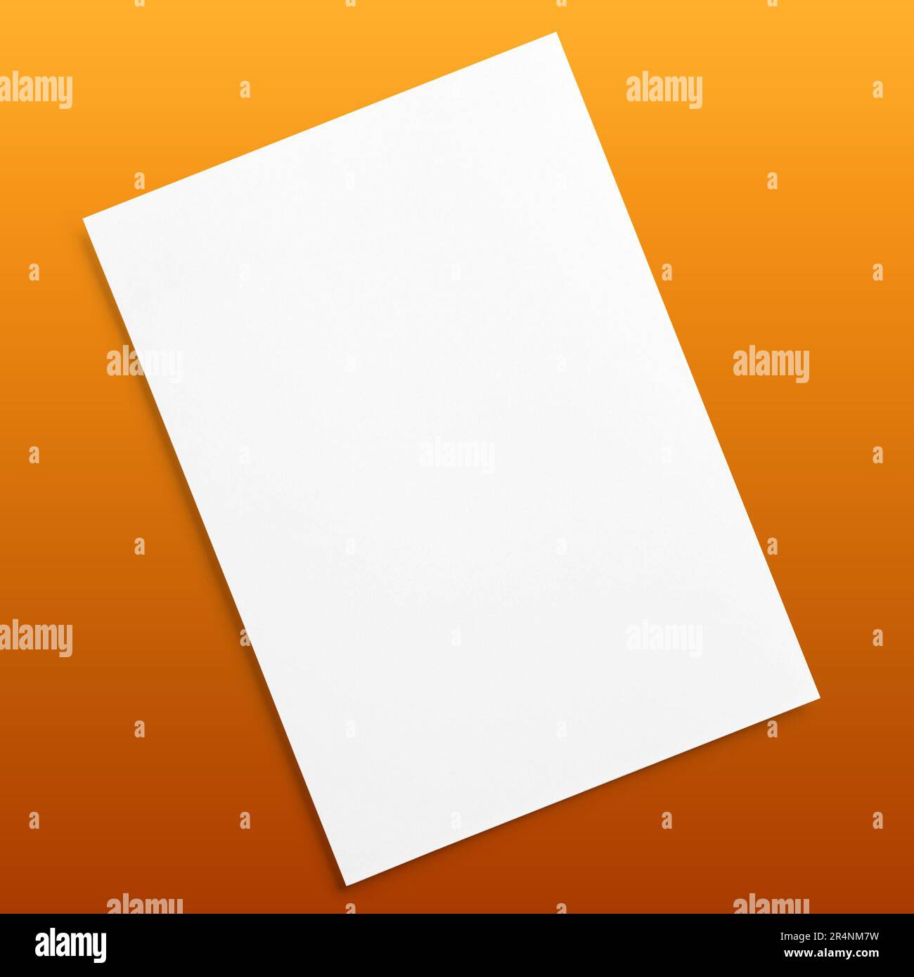 Blank flyer poster isolated on brown to replace your design. Stock Photo