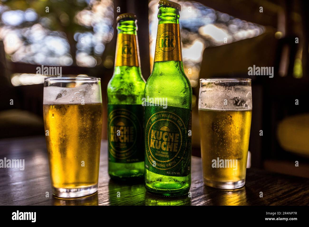 Malawian beer bottle. Kuche Kuche is a locally brewed light beer from Malawi. The name translated means drinking until dawn. Kuche Kuche is the brand of beer from Malawi that you can proverbially drink until dawn. Kumbali Country Lodge in Lilongwe, Malawi Stock Photo