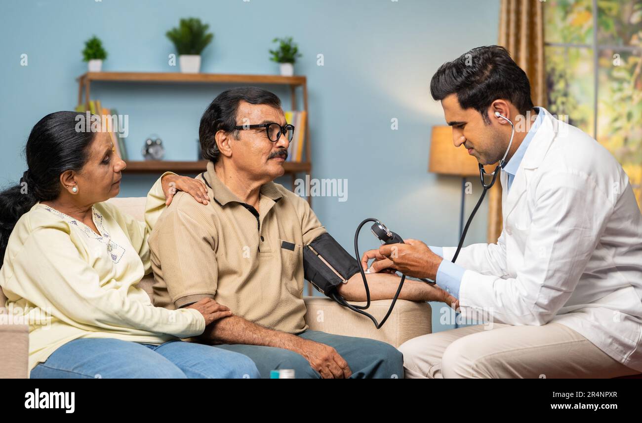 Doctor couple blood pressure hi-res stock photography and images - Alamy