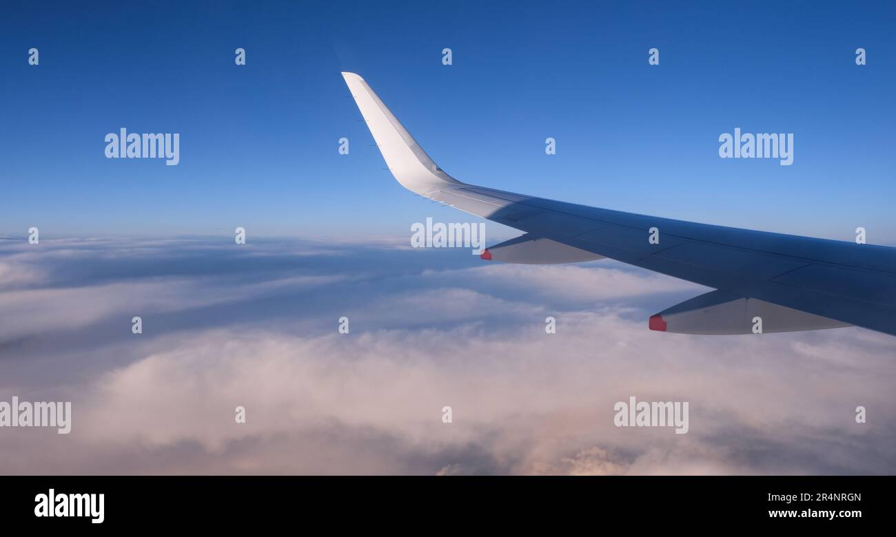 Airplane in flight. People travelling. Aerial view from plane window ...