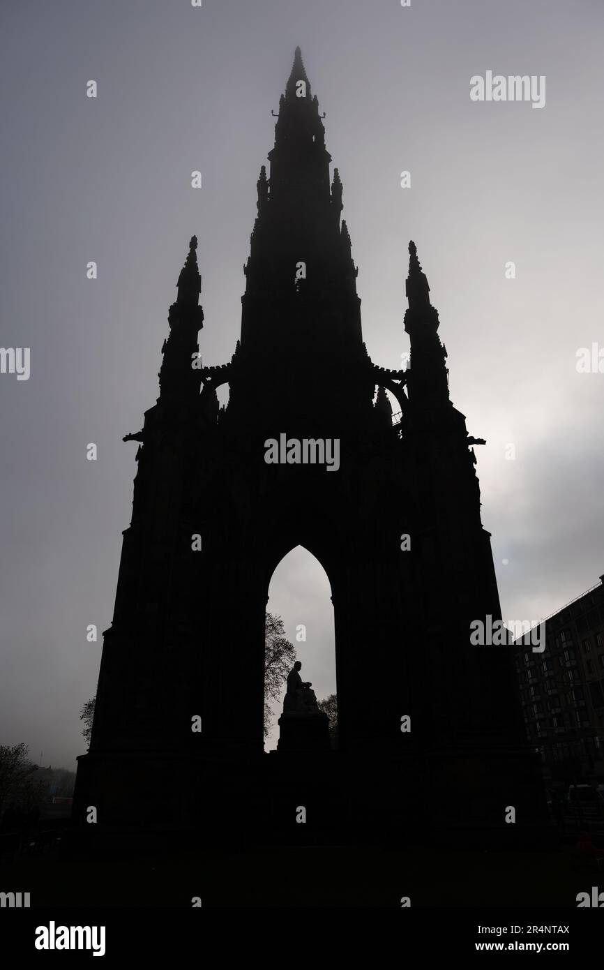 Fog approaching the Scott Monument on gloomy day in city of Edinburgh in Scotland, United Kingdom. Silhouette of Victorian Gothic monument in honour o Stock Photo