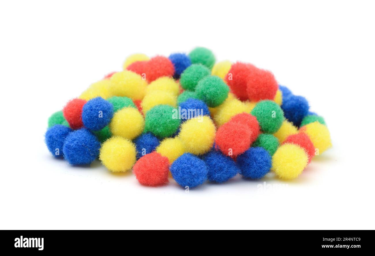 Pile of soft fluffy colorful balls for crafts isolated on white Stock
