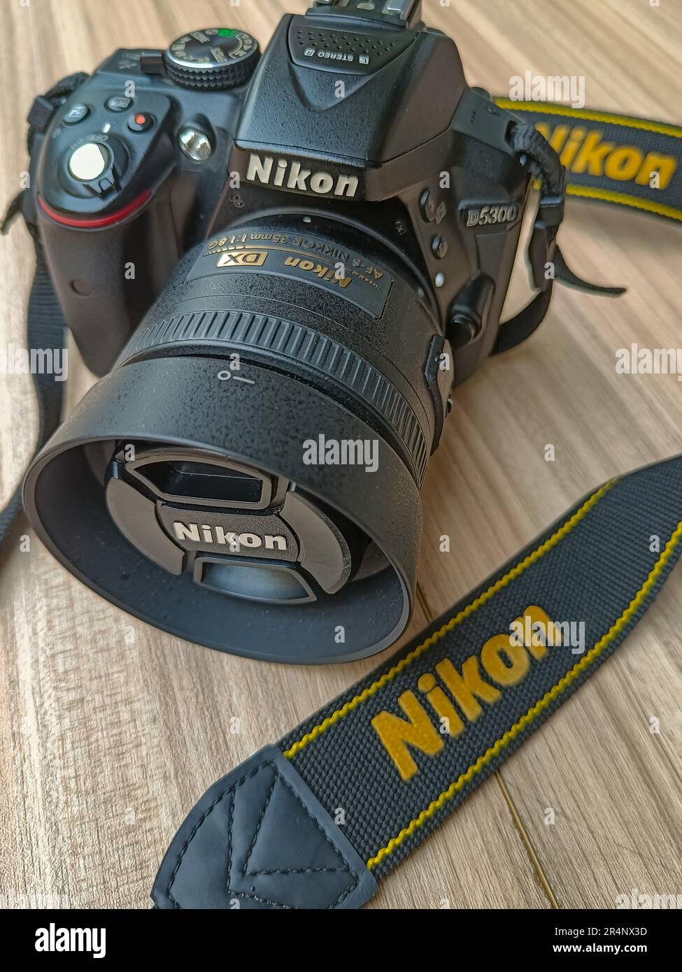 New Delhi, India, May 28 2028 - Nikon D5300 camera with 35mm f2.8 prime  lens on plain background, Nikon DSLR camera shoot Stock Photo - Alamy
