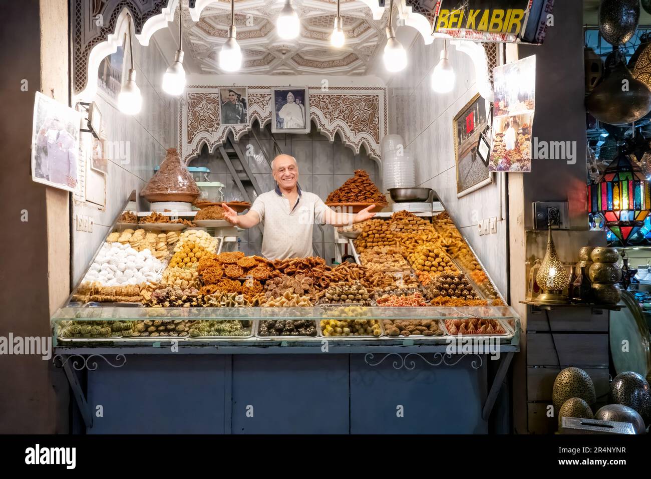 A Belkabir food stall in the Central Souks Medina, Marrakesh, Morocco. Belkabir are traditional Moroccan sweets made from sweet pastry. Stock Photo