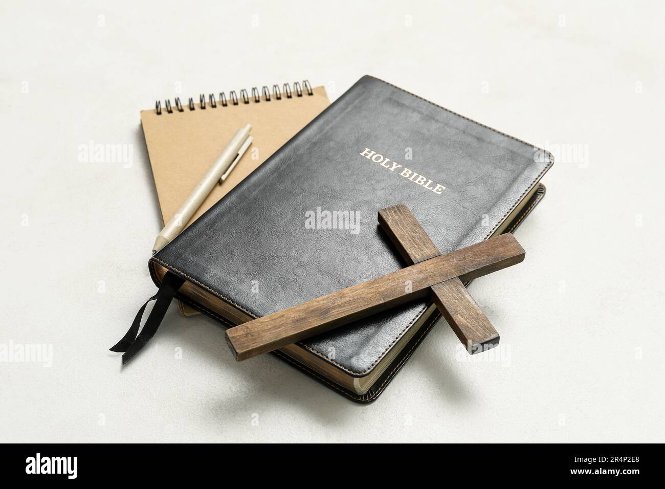 Cross Notebook Holy Bible with wooden cross and notebook on white background Stock ...