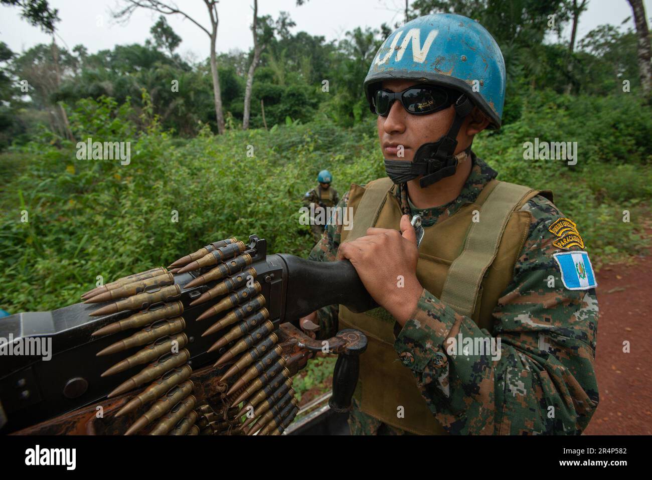 A Guatemalan soldier with the United Nations MONUSCO  peacekeeping force, mans an FN General Purpose Machine Gun mounted on a truck. Stock Photo