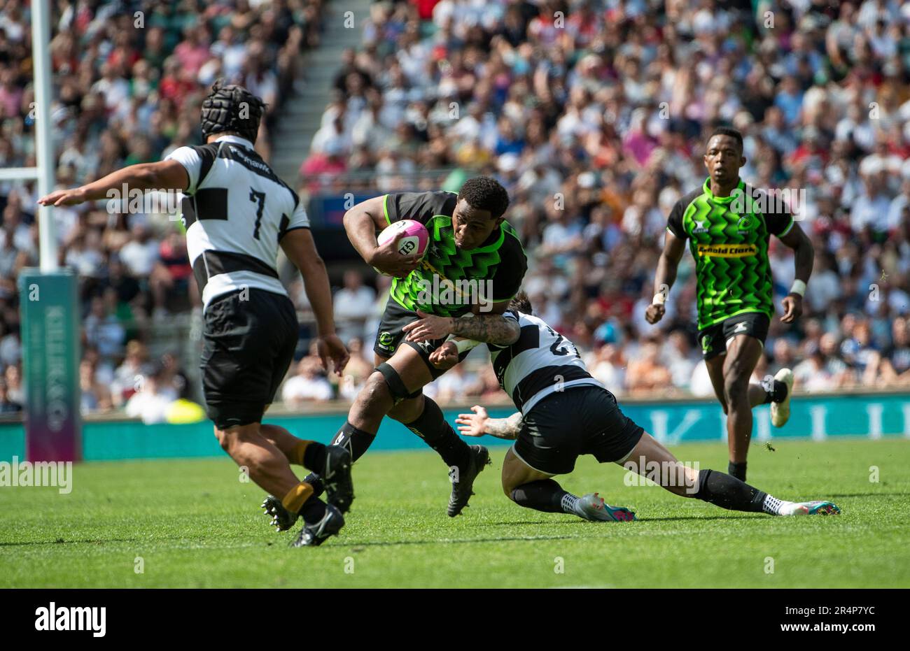 Vilame Mata of the World XV tackled by Francois Hougaard of Barbarians during the Killik Cup match between Barbarians and World XV at Twickenham Stadi Stock Photo