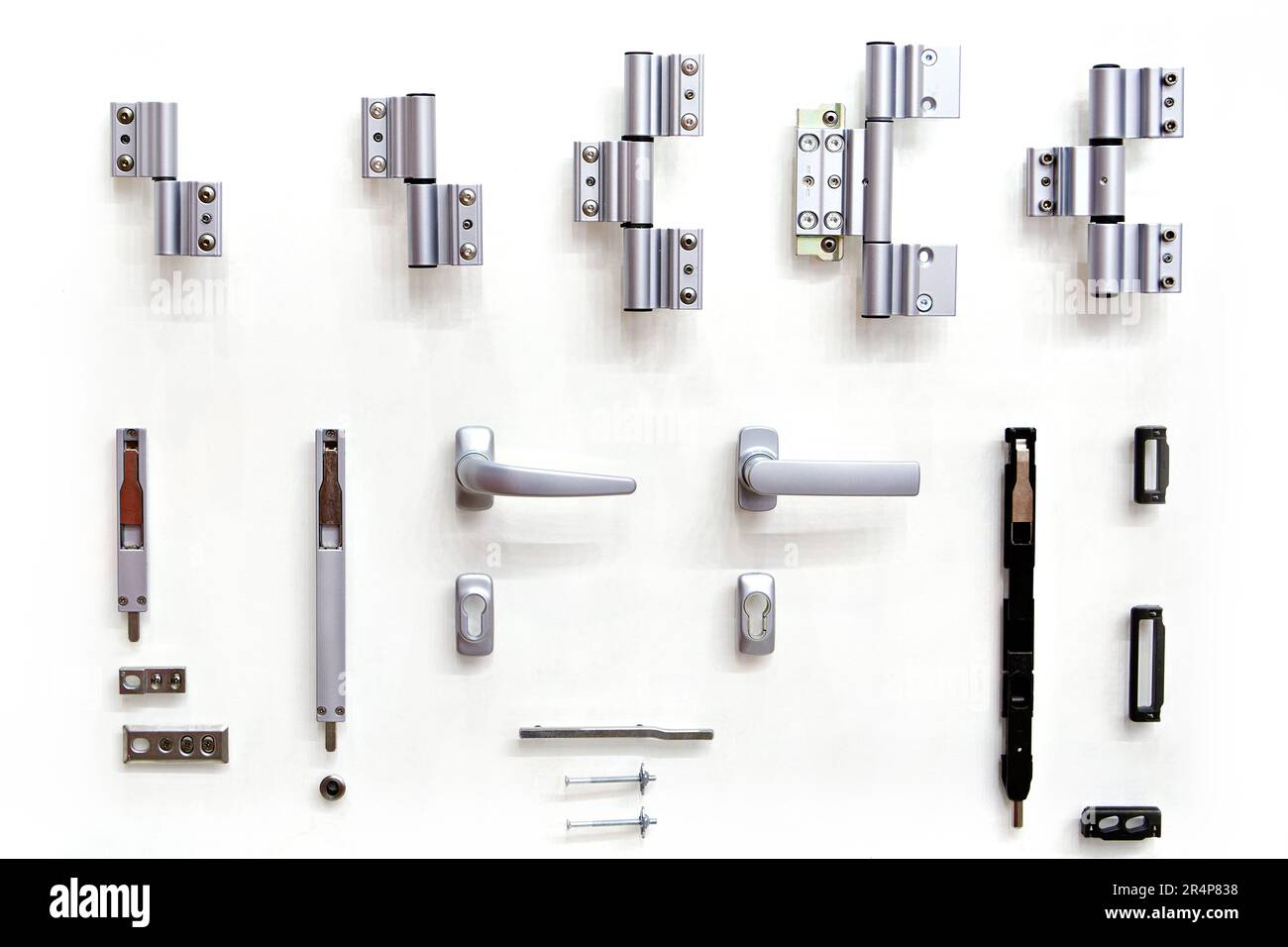 Accessories for doors on bench in shop isolated white Stock Photo Alamy