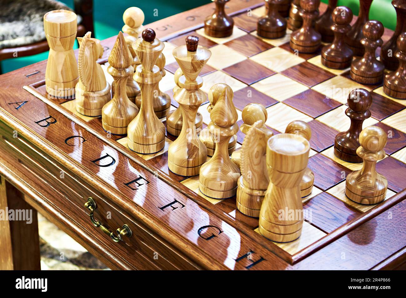 brown chess board with figures on a wooden table in a cafe, playing chess  Stock Photo - Alamy