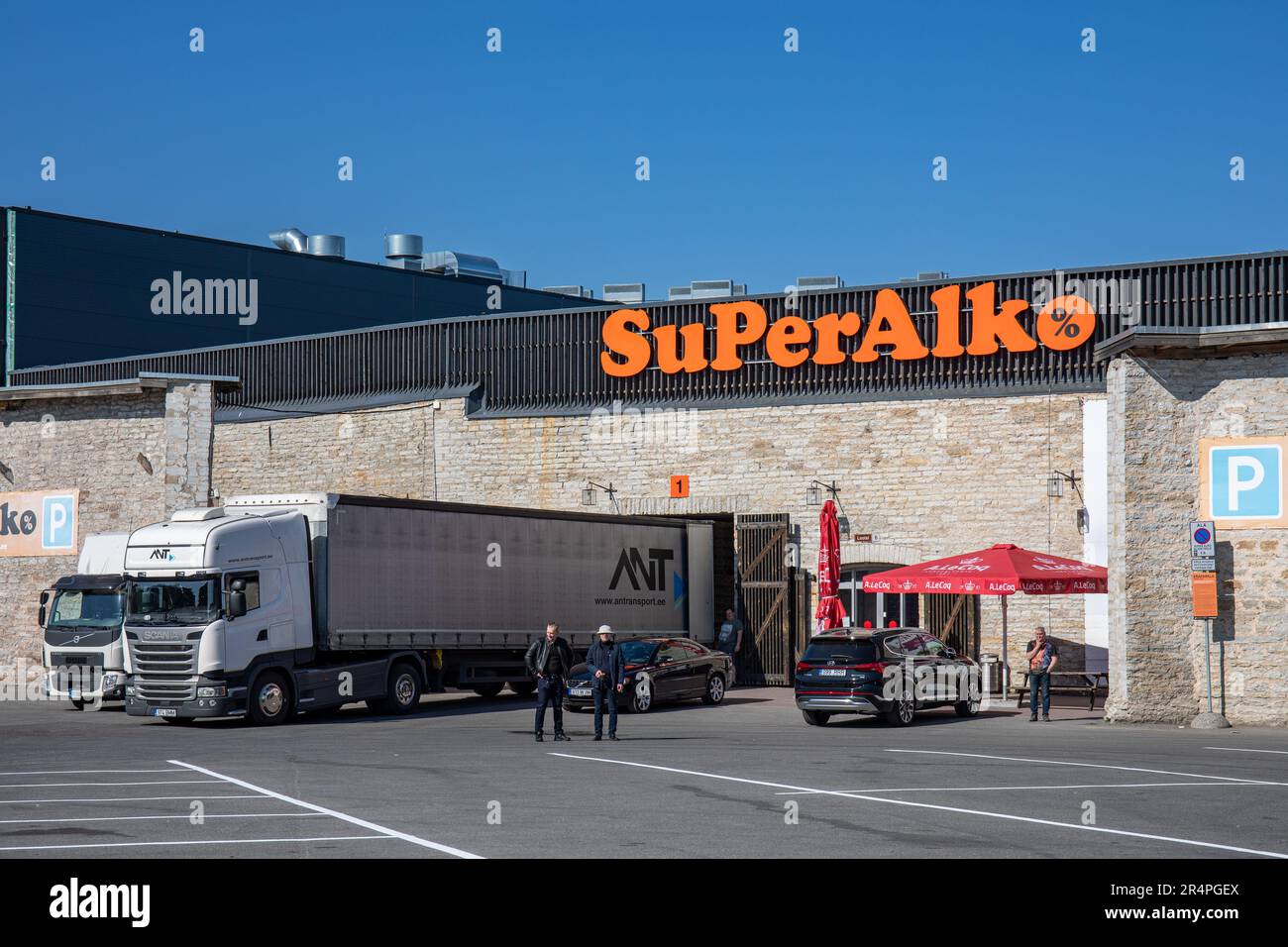 Trucks unloading at SuperAlko alcohol retailer in Sadama district of Tallinn, Estonia Stock Photo