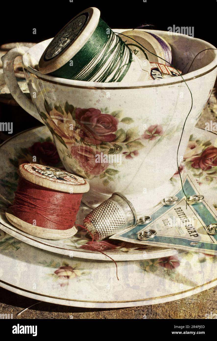 Vintage Tea cup and saucer with sewing kit Stock Photo