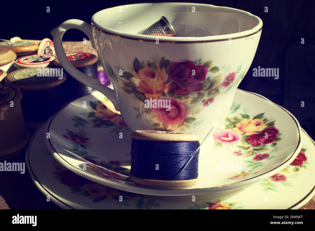 Vintage Tea cup and saucer with sewing kit Stock Photo