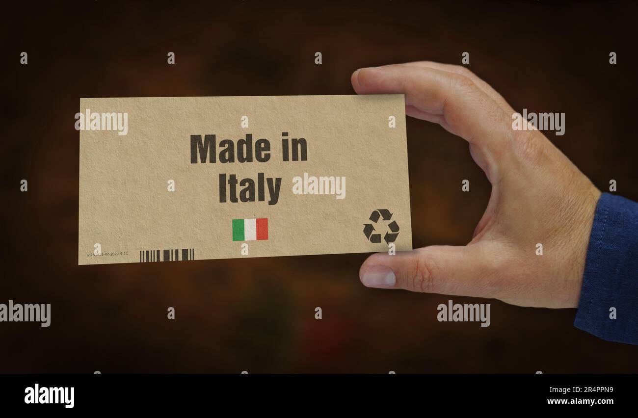 Made in Italy box in hand. Manufacturing and delivery. Product factory, import and export. Abstract concept 3d rendering illustration. Stock Photo