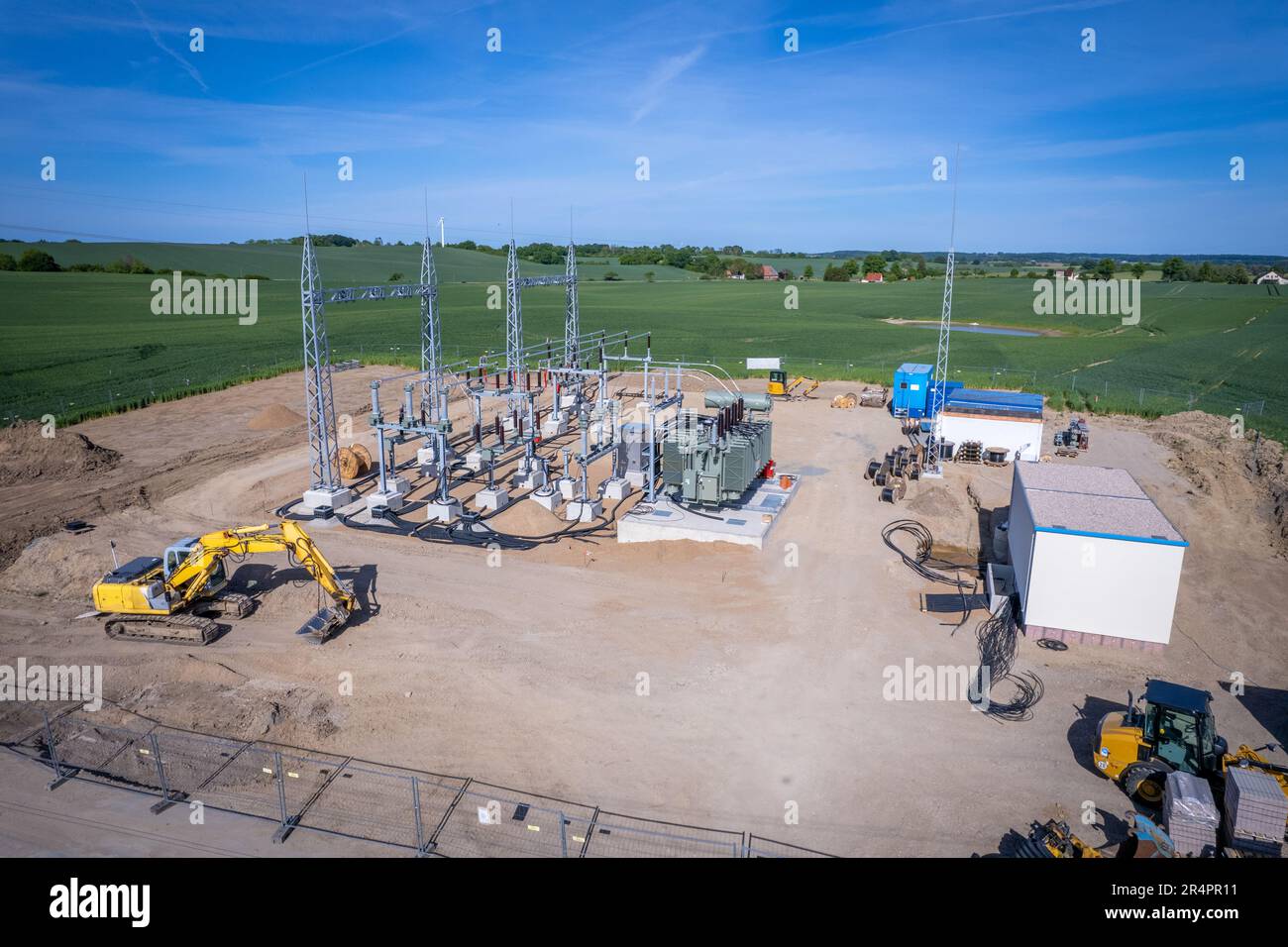 A new power substation is built on a field Stock Photo