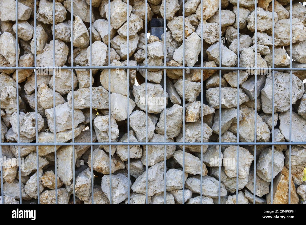 Gabion wire mesh wall. A hexagonal steel cages formed with the purpose of filling with rock and