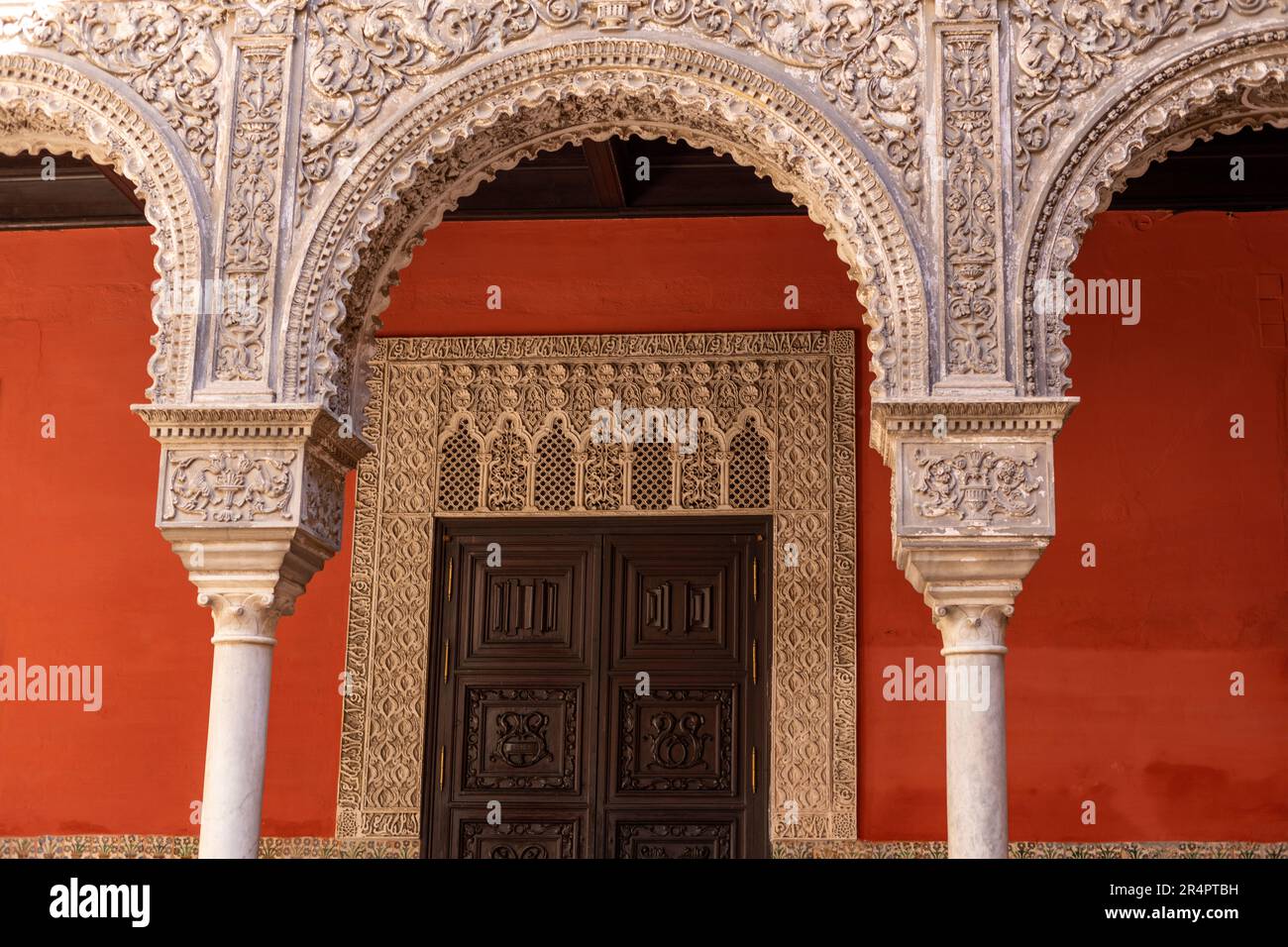 Spain, Seville, Andalusia, Casa de Salinas, 16th Century Palace, interior courtyard arches and doorway Stock Photo