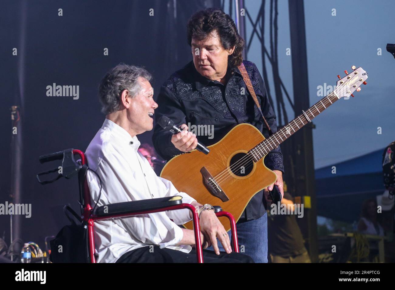 Denham Springs, LA, USA. 27th May, 2023. Shenandoah lead singer Marty Raybon performs with Randy Travis during Day 1 of the 2023 Cajun Country Jam Memorial Day Festival at PADS North Park in Denham Springs, LA. Jonathan Mailhes/CSM(Credit Image: © Jonathan Mailhes/Cal Sport Media). Credit: csm/Alamy Live News Stock Photo