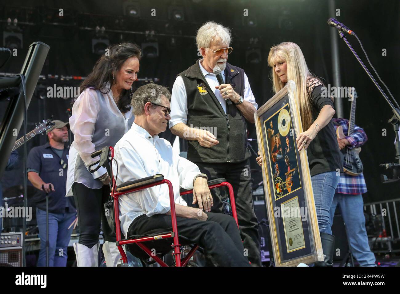 Denham Springs, LA, USA. 27th May, 2023. Country music superstar Randy Travis and his wife Mary Davis look on as Randy is inducted into The Louisiana Music Hall of Fame during Day 1 of the 2023 Cajun Country Jam Memorial Day Festival at PADS North Park in Denham Springs, LA. Jonathan Mailhes/CSM(Credit Image: © Jonathan Mailhes/Cal Sport Media). Credit: csm/Alamy Live News Stock Photo