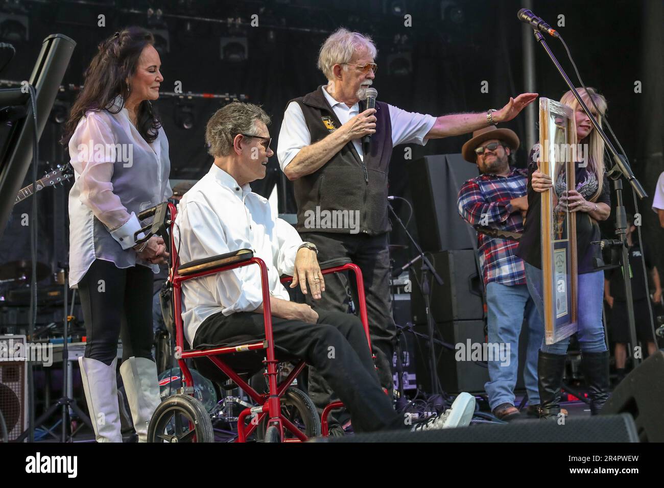 Denham Springs, LA, USA. 27th May, 2023. Country music superstar Randy Travis and his wife Mary Davis look on as Randy is inducted into The Louisiana Music Hall of Fame during Day 1 of the 2023 Cajun Country Jam Memorial Day Festival at PADS North Park in Denham Springs, LA. Jonathan Mailhes/CSM/Alamy Live News Stock Photo