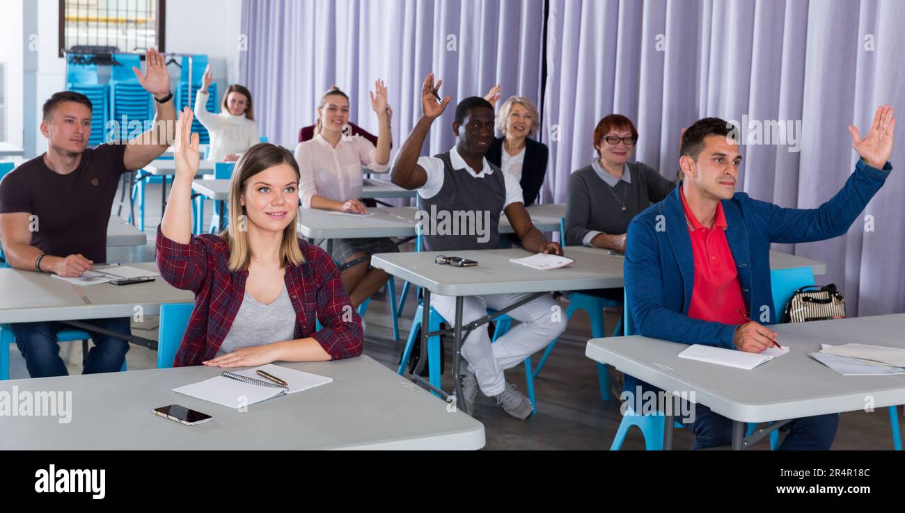 Students audience raising hands hi-res stock photography and images - Alamy