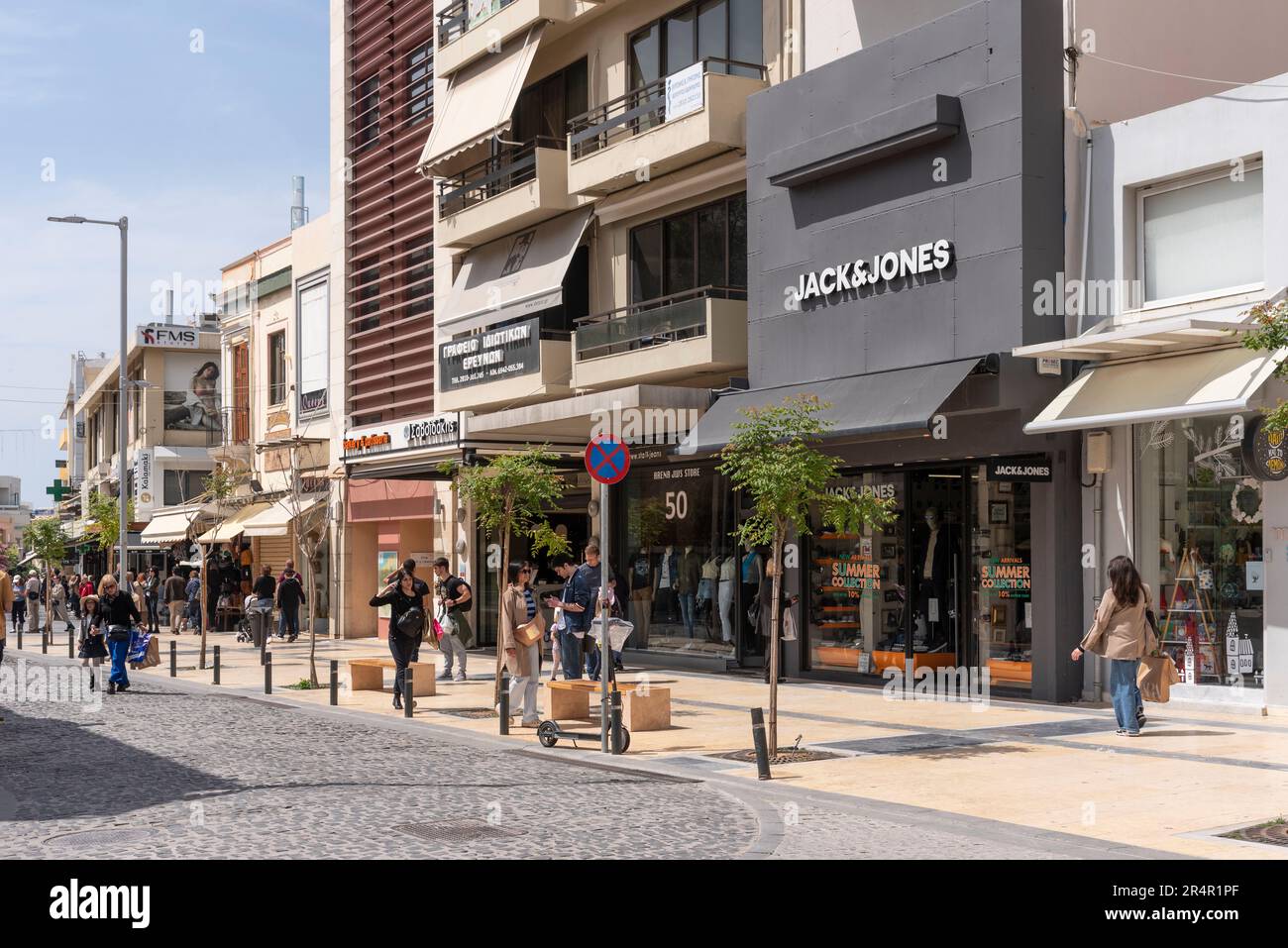 Heraklion, Crete, Greece.2023. Dikaiosynis Street in the city centre with modern shops, offices and apartments along the wide pedestrian area. Stock Photo