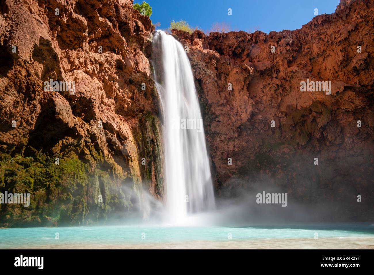 Mooney Falls on Havasu Creek below the campground on a sunny morning. Supai, Arizona, USA. Stock Photo