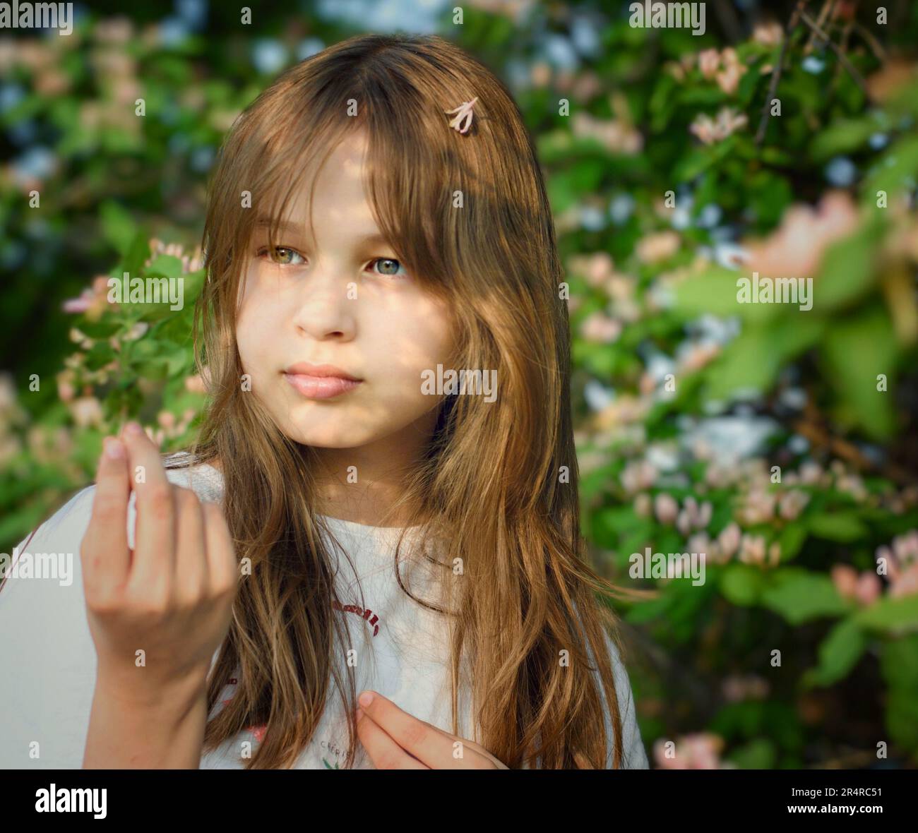 Innocent Portrait of Teenage Girl with Long Blond Hair and Youthful Skin Stock Photo
