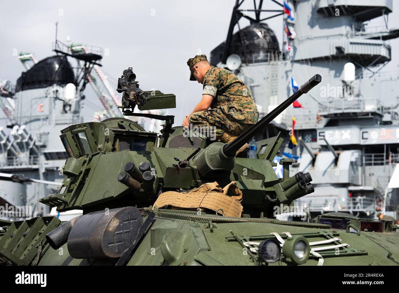 U.S. Marine on top of an armored vehicle Stock Photo