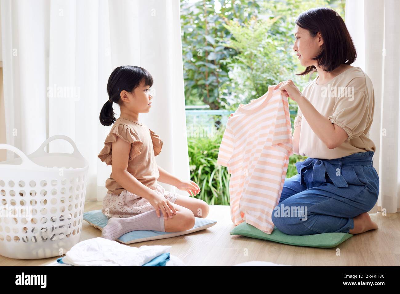 Japanese kid folding clothes Stock Photo Alamy
