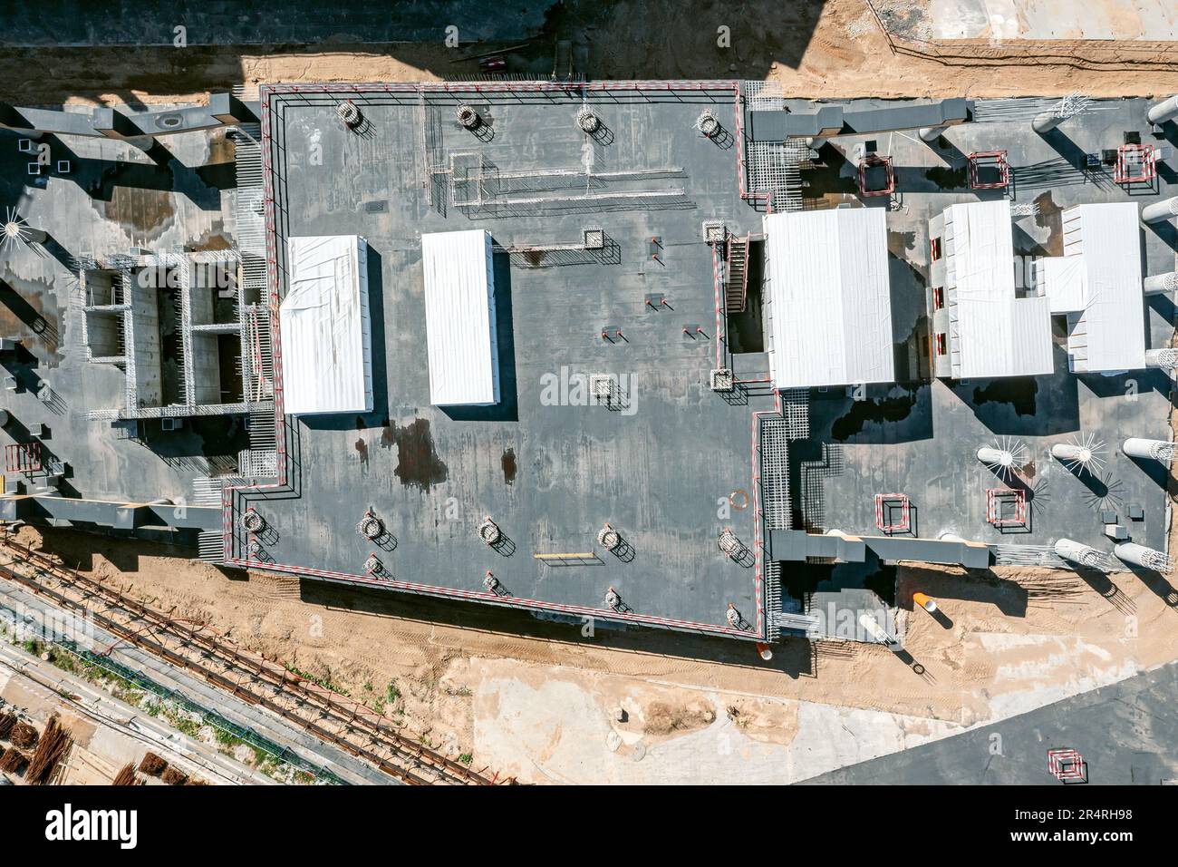 monolithic concrete building of commercial center. construction works stopped. aerial top view. Stock Photo