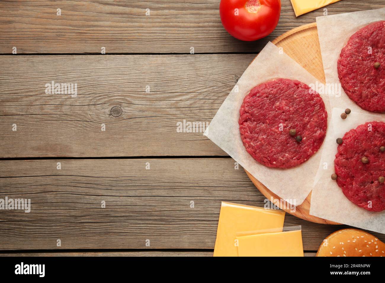 Raw Ground beef meat Burger steak cutlets on grey wooden table. Top view Stock Photo Alamy